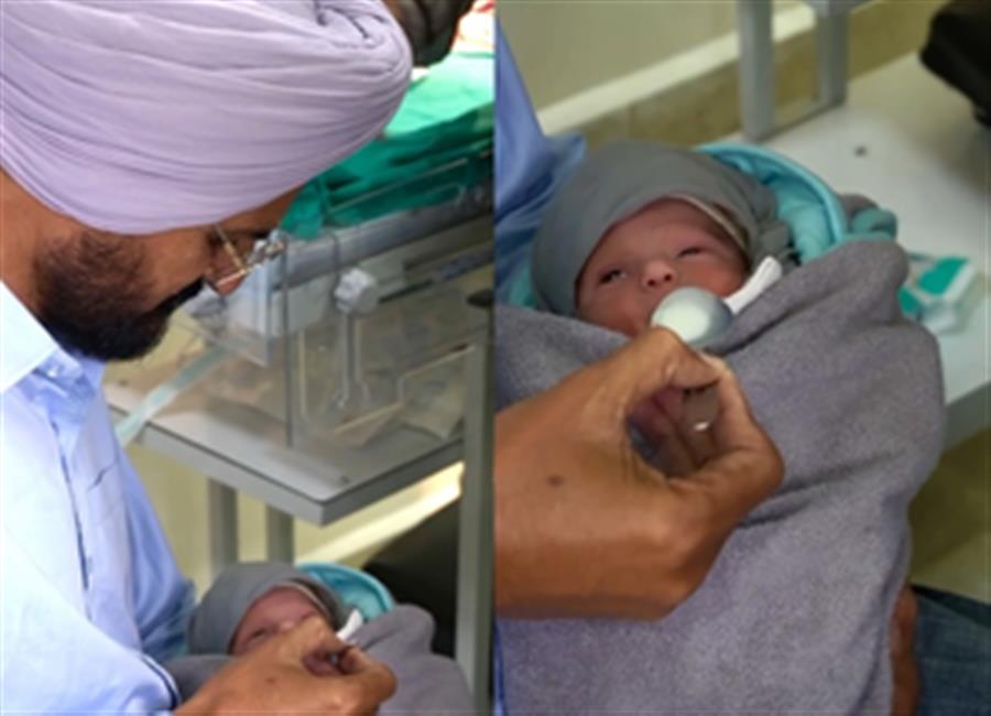 Sidhu Moose Wala’s father spoon feeds milk to newborn child, cuts cake to celebrate