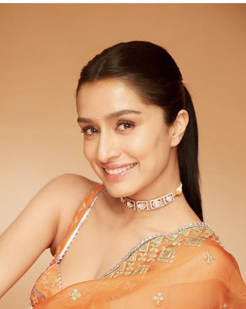 Bollywood actress Shraddha Kapoor specially dressed up for her fans on Diwali. She looks gorgeous in Saffron Saree. 